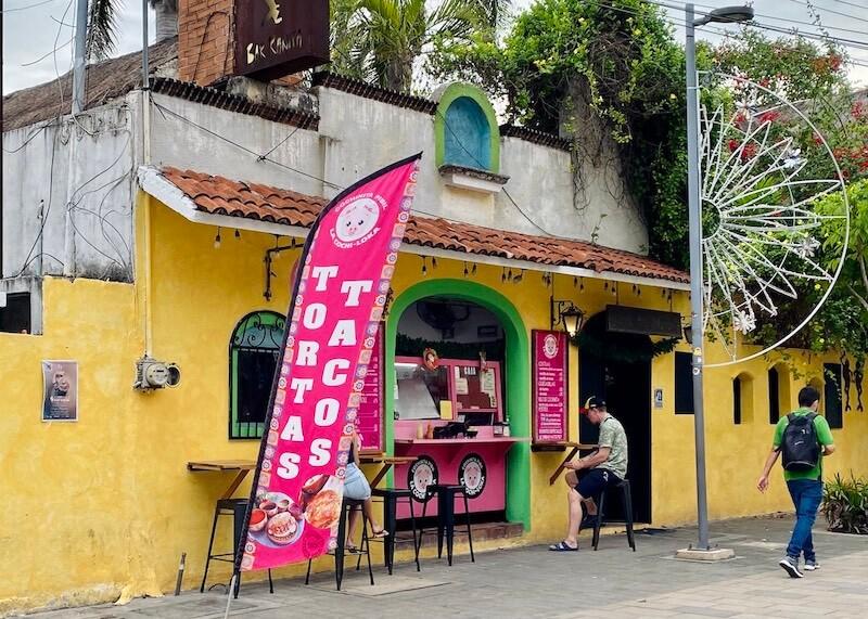 storefront of cochinita pibil tacos